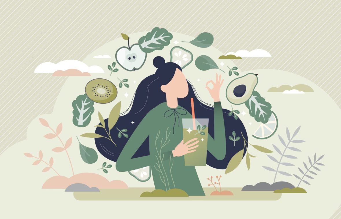 femeie înconjurată de legume și fructe care urmează dieta vegană