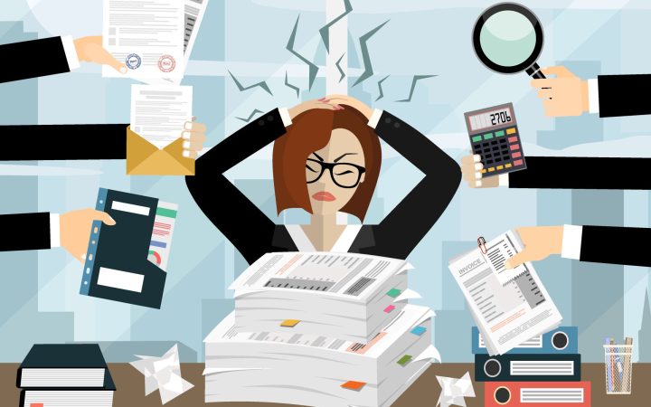 femeie care se confruntă cu stresul la serviciu