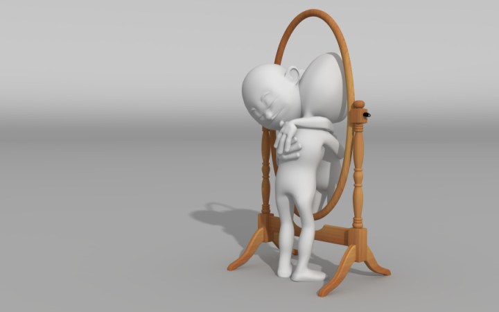 persoană îmbrățișând imaginea din oglindă semnificând acceptarea de sine