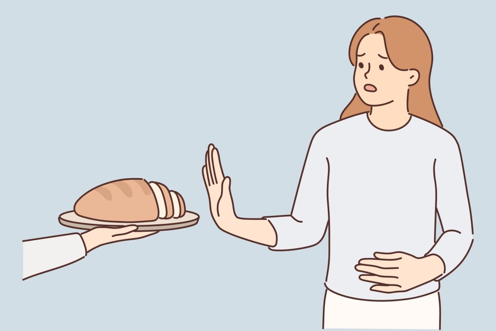 glutenul e usor sa confunzi alergia la gluten cu intoleranta si cu boala celiaca. femeie care refuză pâinea