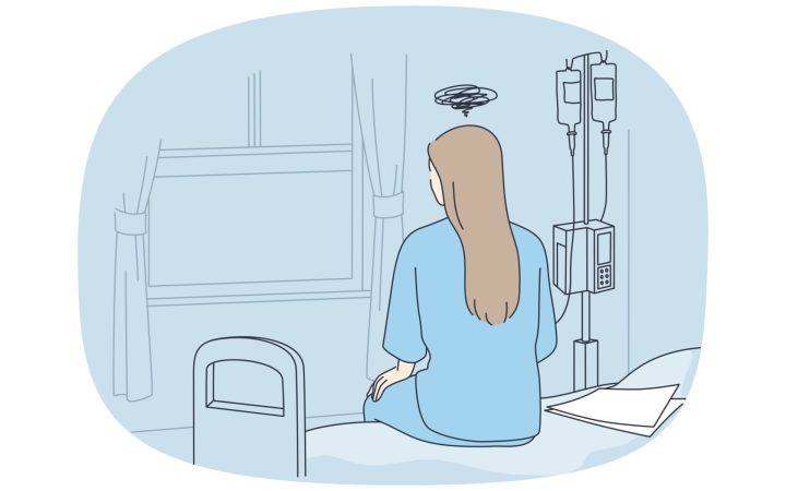 cancer la tineri. femeie cu cancer la spital, pe marginea patului